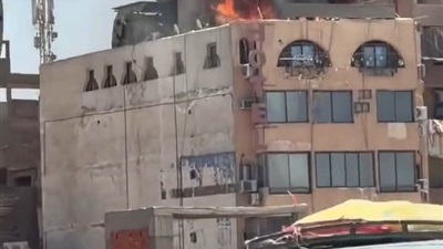 الحماية المدنية بأسيوط تسيطر علي حريق أعلي فندق الحسين بالمحطة 